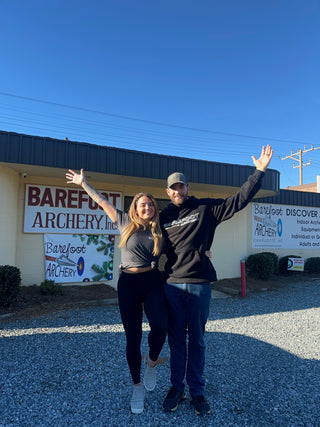 Chrystal and Jeff in front of barefoot archery store