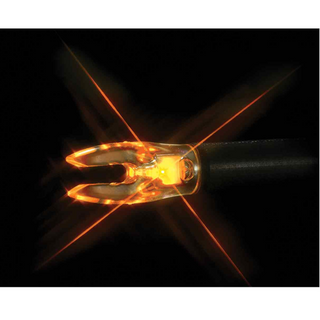 Close-up of a glowing orange arrow nock on a black background
