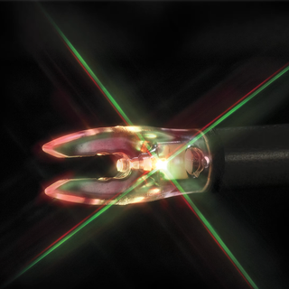 Close-up of a glowing red and green arrow nock on a black background