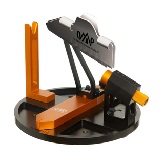 orange and black fletching jig on a white background