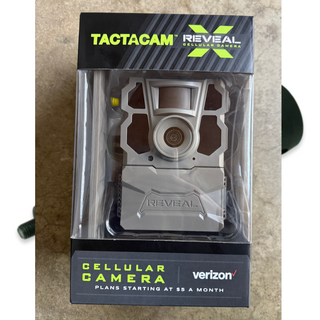 tactacam reveal  cellular camera in box, front view on concrete background