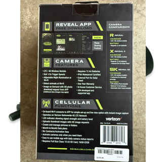 tactacam reveal x camera box, back view on concrete background