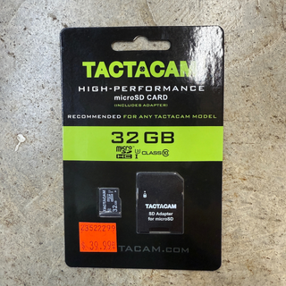 TACTACAM SDHC 32GB MEMORY CARD in packaging on cement background