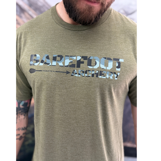 man wearing barefoot archery tee with camo logo, military green shirt front view
