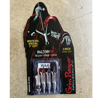 Grim Reaper Broadheads in package on cement background