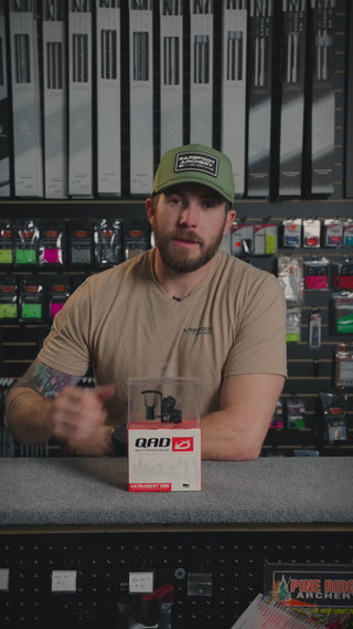 man behind the counter at an archery shop talking about the QAD HDX rest