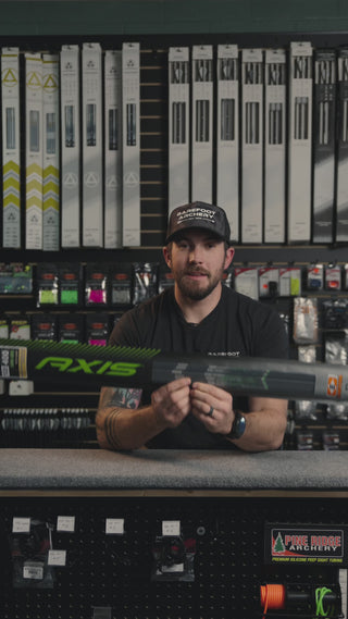 man behind the counter at an archery shop talking about easton axis arrows