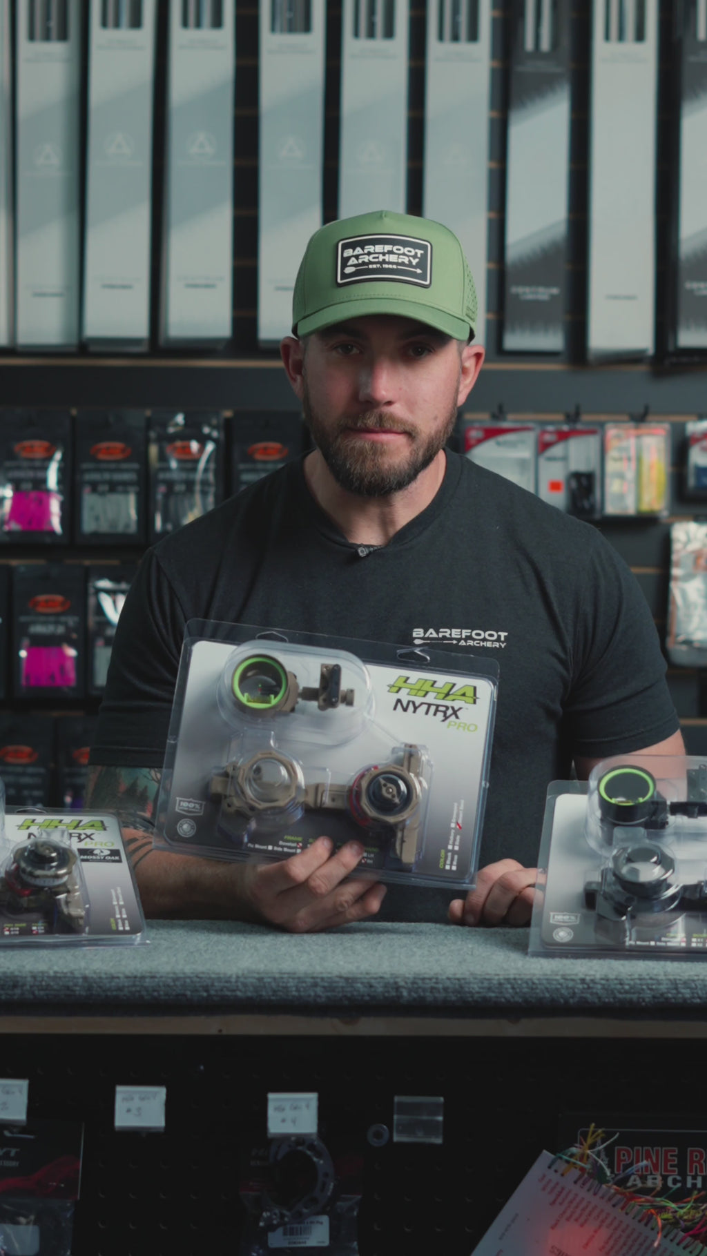 man behind the counter at an archery shop talking about the HHA Nytrx Pro