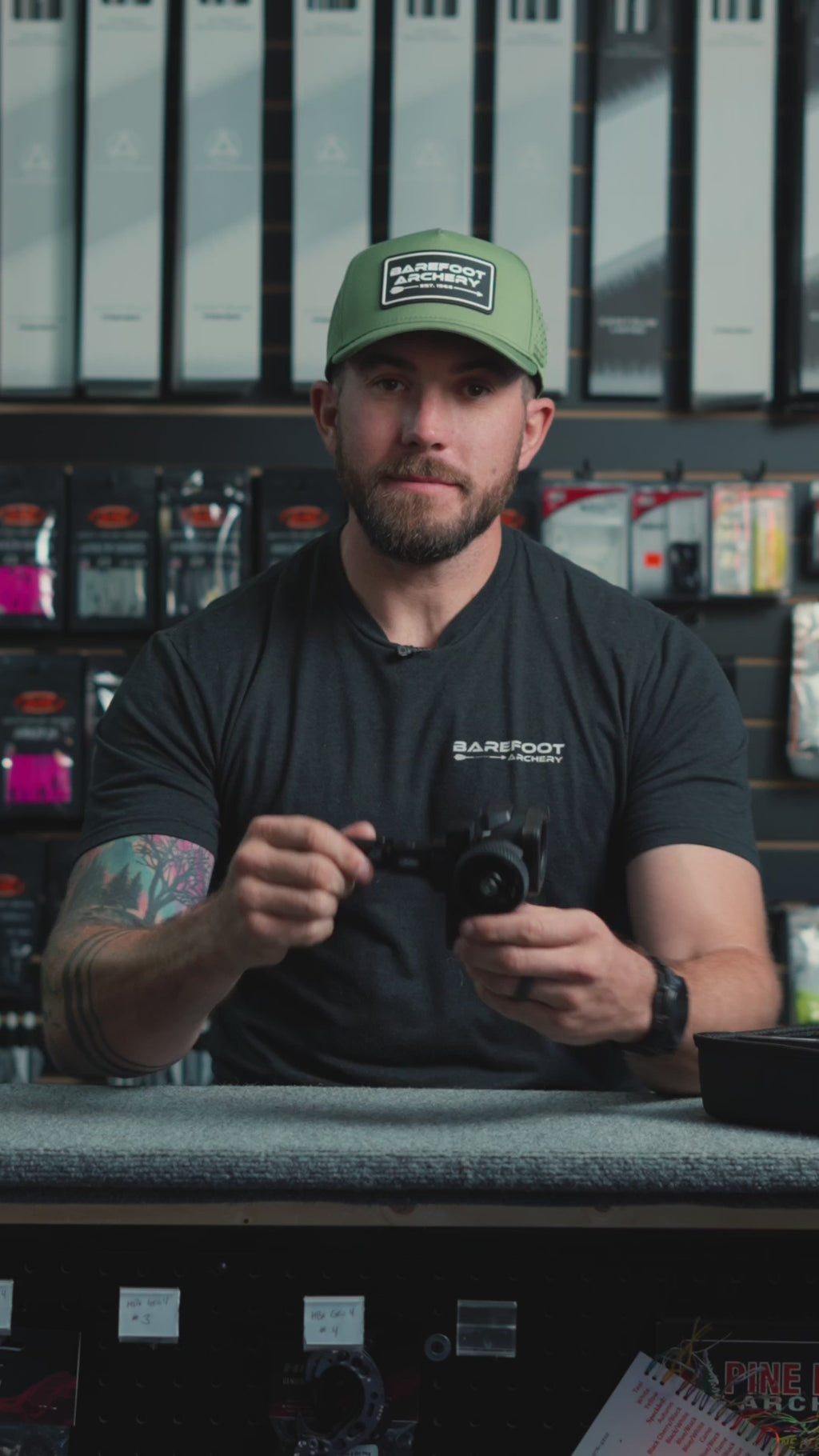 man behind the counter at an archery shop talking about the Mathews UV Slider