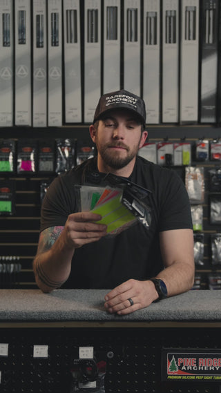 man behind the counter at an archery shop talking about the barefoot archery wrap