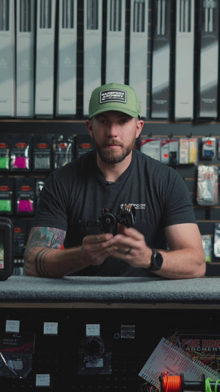 man behind the counter at an archery shop talking about the Driver by Axcel