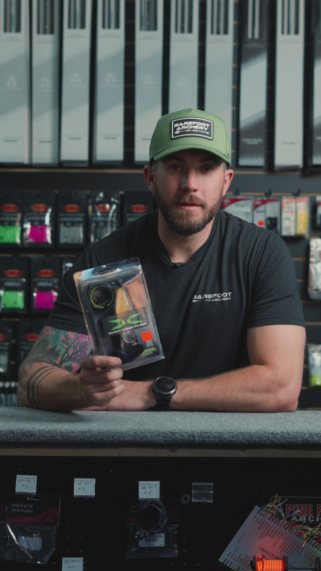 man behind the counter at an archery shop talking about the HHA Optimizer Lite