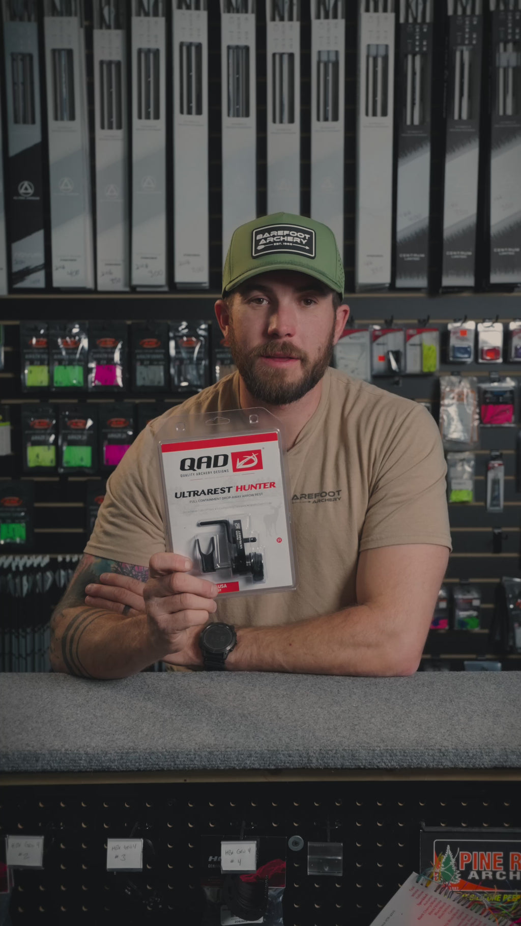 man behind the counter at an archery shop talking about  QAD Ultrarest Hunter