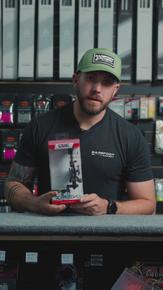 man behind a counter describing the CBE Trek Pro