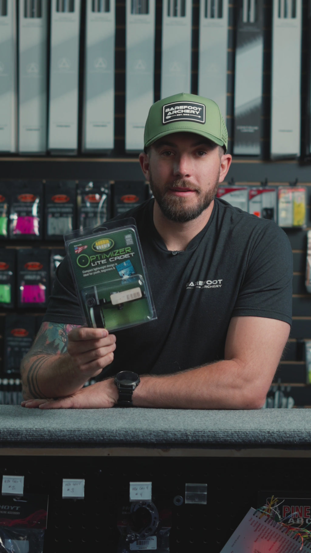 man behind the counter at an archery shop talking about the HHA Optimizer Lite Cadet