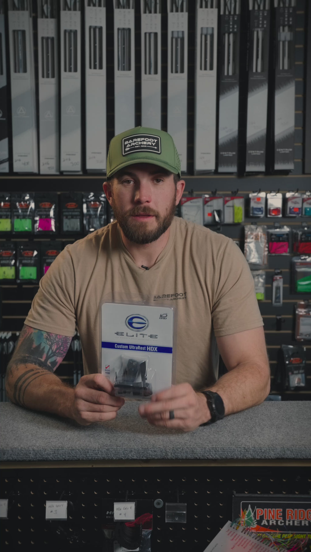 man behind the counter at an archery shop talking about the Elite Ultrarest HDX