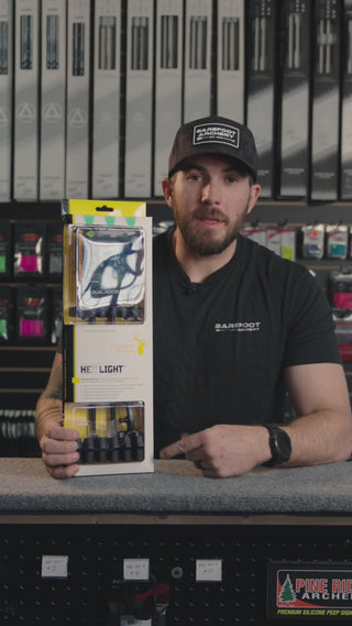 man at an archery shop behind the counter discussing the Trophy Ridge Hex Light quiver