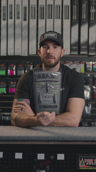 man in an archery shop behind the counter discussing the beast titanium broadheads