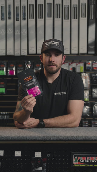 man behind the counter at an archery shop talking about AAE Airrazr 26 vanes