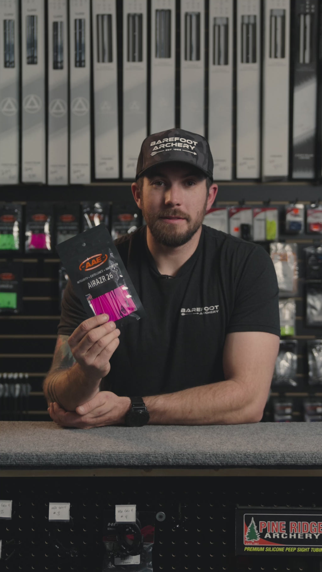 man behind the counter at an archery shop talking about AAE Airrazr 26 vanes