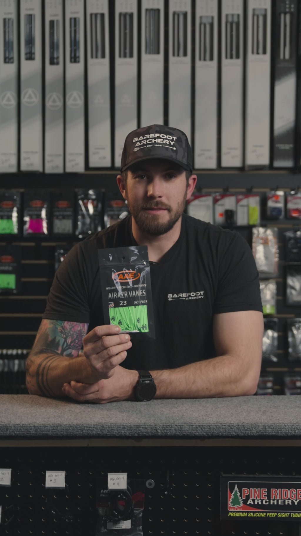 man behind the counter at an archery shop talking about the AAE Airrazr Vanes