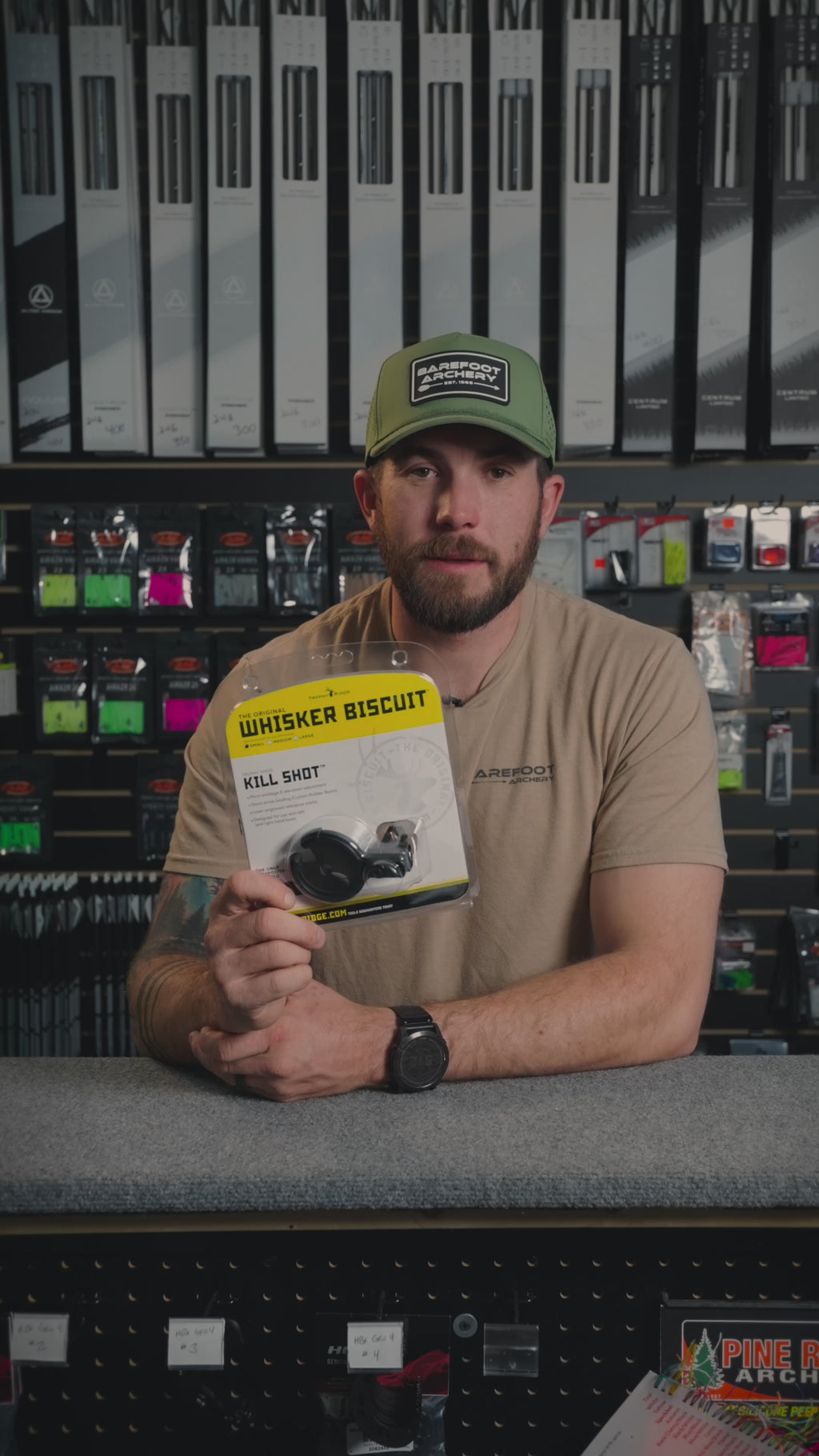 man behind the counter at an archery shop talking about the Trophy Ridge Kill Shot Whisker Biscuit